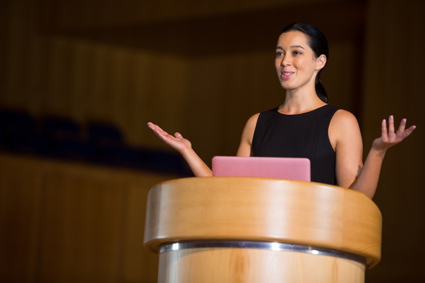 A business executive speaking at a conference
